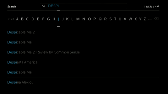 Letters of the alphabet display across the screen. The letter "i" is selected. The letters "DESPI have now been slected and several selections beginning with these letters appear for selection